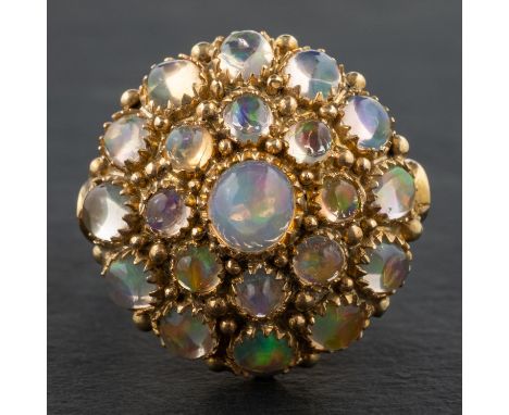 A round, cabochon-cut opal cluster cocktail ring, stamped '14K', length of ring head ca. 2cm, ring size L1/2, total weight ca