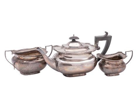 A George V silver three-piece tea service, maker Charles S Green &amp; Co Ltd, Birmingham, 1923: of squat barge-shaped outlin