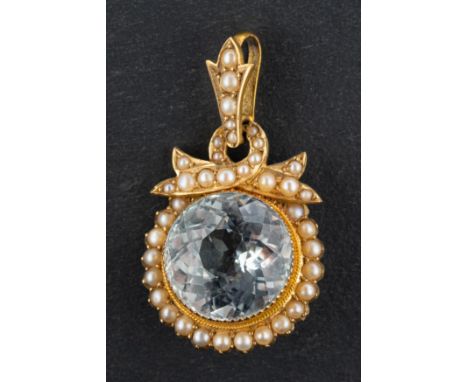 A round, mixed-cut light blue topaz and seed pearl pendant, estimated topaz weight ca. 13cts, stamped '15CT', length (inc jum