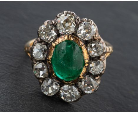 A 19th century, cabochon-cut emerald and old-cut diamond cluster ring, estimated emerald weight ca.  2cts, total estimated di