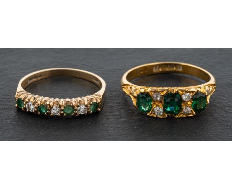 Two gemset rings, including a 9ct gold, emerald and diamond half eternity band and an 18ct gold, imitation emerald  three-sto