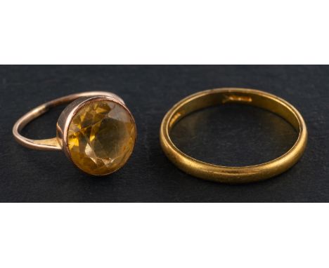 Two rings, including a round, mixed-cut citrine ring, estimated citrine weight ca. 4.30cts, ring size F; and a band ring with
