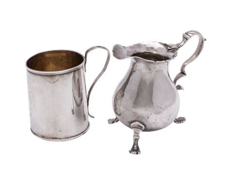A George II cream jug, makers mark obscured, possibly Richard Zouch, London 1743 of pear-shape with foliate capped scroll han