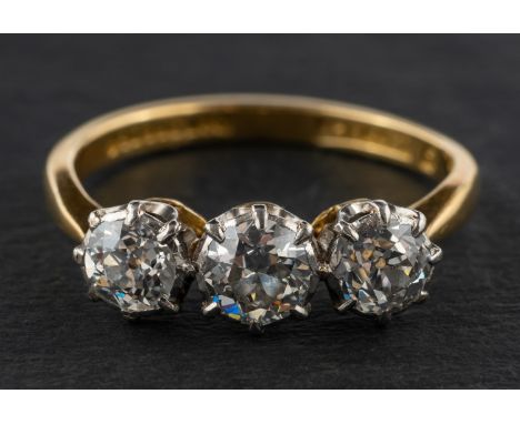 An old-cut diamond, three-stone ring, total estimated diamond weight ca. 1.10cts, H-I colour, SI1-2 clarity, stamped '18CT &a