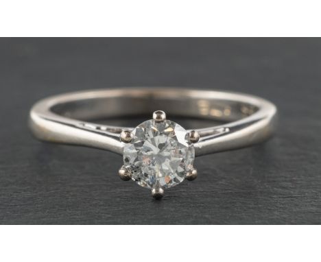 A round, brilliant-cut diamond, single-stone ring, diamond weight 0.78ct according to engraving, G-H colour, SI2-P1 clarity, 