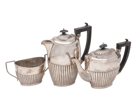 A George V  three- piece silver tea service, maker Joseph Gloster Ltd, Birmingham 1913/18: of oval tapering form with half re