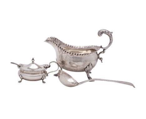 An early George III silver sauceboat, maker William Skeen, London 1762, 255.9gms, 8.2ozs,with double volute handle and crimpe
