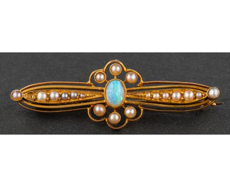 An early 20th century, oval, cabochon-cut opal and seed pearl openwork brooch, estimated opal weight ca. 0.30ct, stamped '15C