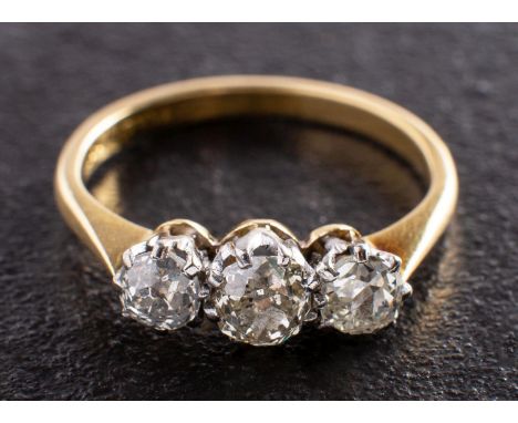 A cushion-cut diamond, three-stone ring, total estimated diamond weight ca. 1.10cts, I-J colour, P1-2 clarity, stamped '18CT'