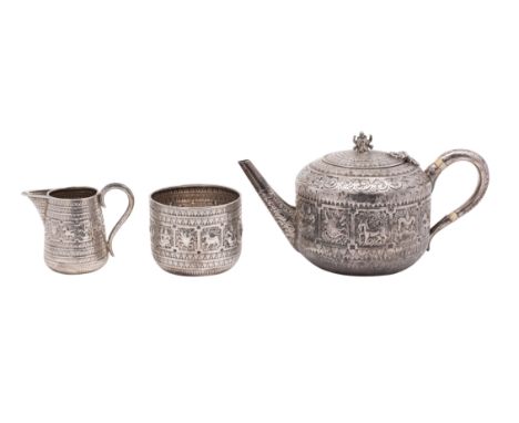 A Victorian silver three-piece tea service in the Indian manner, maker Hamilton &amp; Inches, Edinburgh 1876 comprising: teap