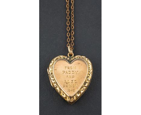 A heart-shaped locket pendant, with inscription to front, stamped '9CT', length (exl jump ring) ca. 2.5cm on a gilt metal cha