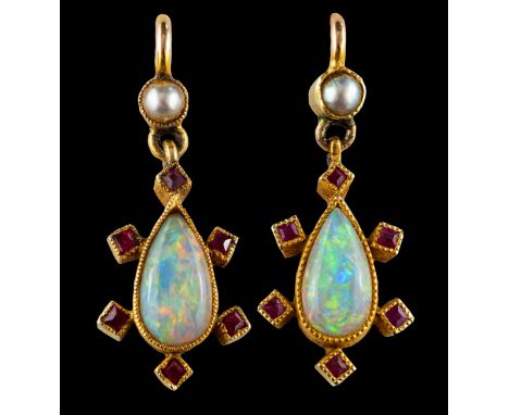 A pair of late 19th/ early 20th century, pear-shaped, cabochon-cut opal, ruby and seed pearl drop earrings, total estimated o