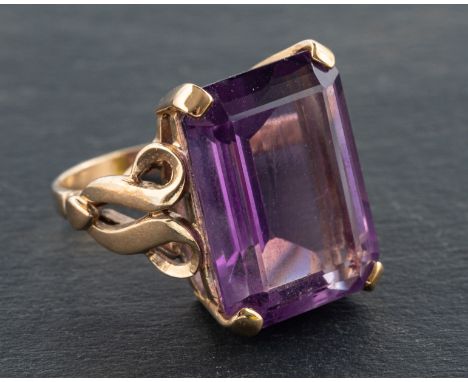 An octagonal, step-cut amethyst ring, estimated amethyst weight ca. 12.7cts, length of ring head ca. 1.8cm, ring size J1/2, t