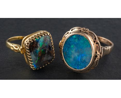 Two opal rings, including a rhomboid, boulder opal ring, length of ring head ca. 1.8cm; and an oval, black opal doublet ring,