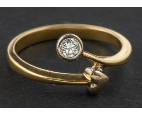 A round, brilliant-cut diamond and heart-shaped decoration, cross-over ring, estimated diamond weight ca. 0.10ct, H-I colour,