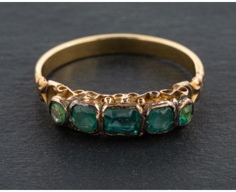 A green paste five-stone ring, length of ring head ca. 1.6cm, ring size M, total weight ca. 2.2gms. 
