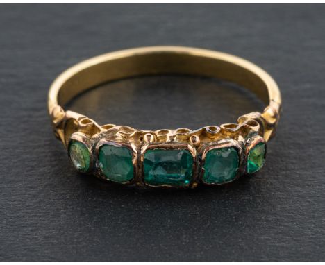 A green paste five-stone ring, length of ring head ca. 1.6cm, ring size M, total weight ca. 2.2gms. 