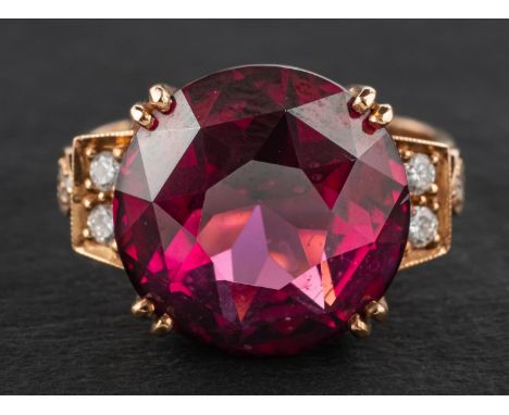 An 18ct gold, round, faceted rhodolite garnet and round, brilliant-cut diamond ring, estimated garnet weight ca. 11cts, estim