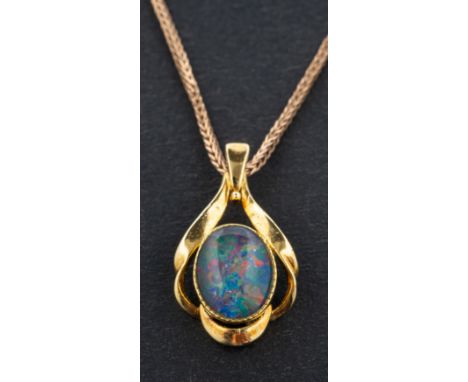 An oval, cabochon-cut opal doublet pendant, stamped 'SIL', length ca. 2.3cm, together with a 9ct gold foxtail-link chain, len