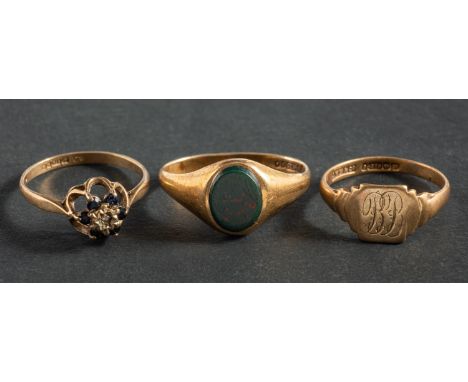 Three 9ct gold rings, including a bloodstone signet ring, a signet ring engraved with monogram 'BB', and a sapphire and diamo