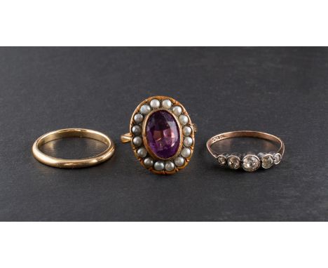 Three rings, including a white paste five stone ring, stamped '9CT'; a 9ct gold band ring and a purple paste and imitation se