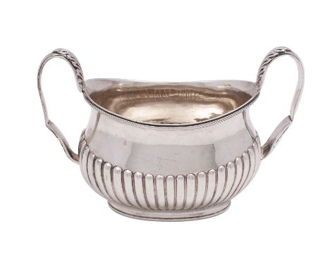 A Victorian silver twin-handled sugar basin of oval boat-shaped outline, makers William Hutton &amp; Sons, London 1882, with 