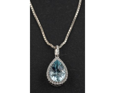 An 18ct gold, pear-shaped, chequerboard-cut aquamarine and diamond cluster pendant, aquamarine weight 1.48cts and total diamo