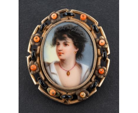 A late 19th century, probably Italian, coral and black enamel portrait miniature locket brooch, depicting a young rustic in p