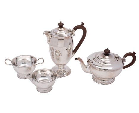 A George V silver four-piece tea and coffee service, makers William Suckling Ltd, Birmingham 1930 of circular pedestal shape,