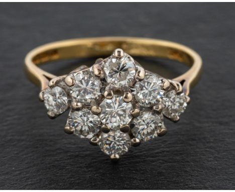 A 1970's 18ct gold round, brilliant-cut diamond cluster ring, total estimated diamond weight ca. 1.05cts, G-H colour, SI1-2 c
