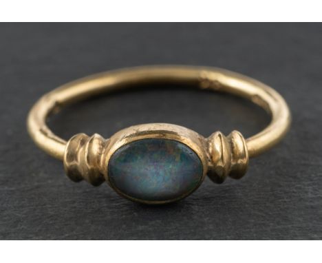 A 9ct gold, black opal doublet ring, with import marks for London, 1978, length of ring head ca. 1.3cm, ring size M, total we