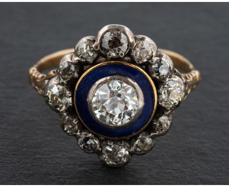 An early 19th century, blue enamel and old-cut diamond target ring, estimated weight of principal diamond ca. 0.75ct, H-I col
