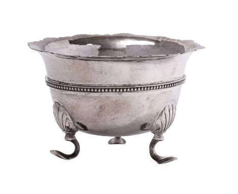 An Irish silver circular sugar basin, makers William Egan &amp; Sons, Dublin 1977 with a wavy edge and beaded rim, on tripod 