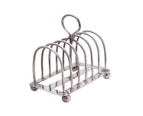 An Edward VII silver six-division toast rack, maker Mappin & Webb, Sheffield, 1906 of rectangular outline with hooped divider