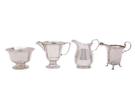 A George V silver cream jug, makers William Hutton &amp; Sons Ltd, Sheffield 1932 of pear shape, also another cream jug, Birm