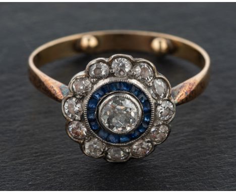 An Art Deco style, calibre cut sapphire and old-cut diamond target ring, estimated weight of principal diamond ca. 0.20ct, H-