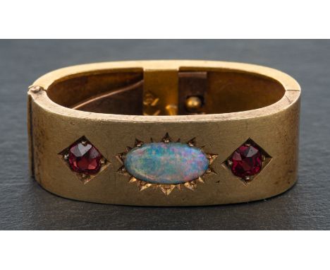 An early 20th century, red paste and opal doublet, hinged tie clip, stamped '15CT', total length ca. 2.9cm, total weight ca. 