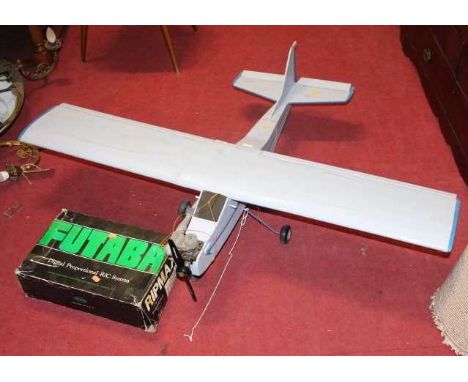 A scratch built remote controlled model aeroplane, with charger and remote control unit