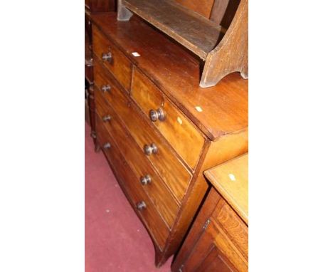 An early 19th century mahogany squarefront chest, of two short over three long graduated drawers, on splayed bracket supports