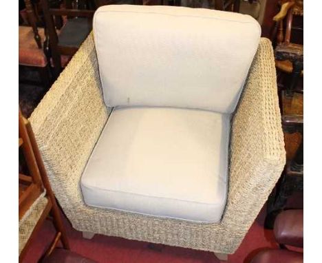 A contemporary rattan two-piece conservatory suite comprising; two seater sofa and single armchair with cushioned upholstery,