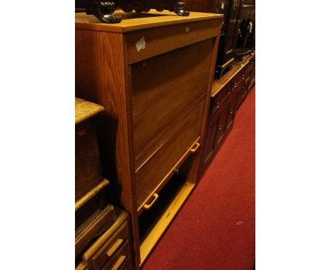 A light oak tambour fronted office cabinet, width 96cmCondition report: A couple of splits to tambour.General wear throughout