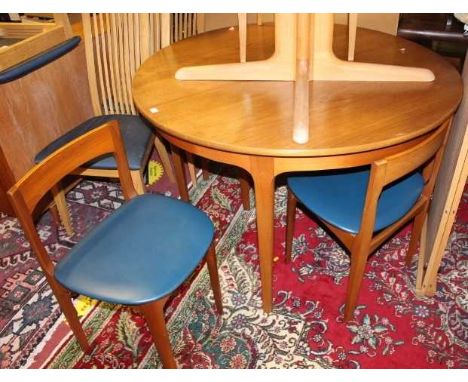 A 1970s Nathan teak dining suite comprising; D-end extending table, having pull-out action and single fold-out leaf, max leng