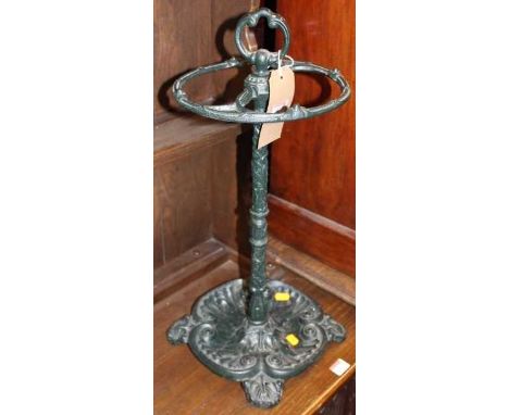 A green painted cast iron circular twin division stick stand, height 56cm