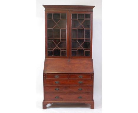 A George III mahogany bureau bookcase, the associated upper section having twin astragal glazed doors, the base having a slop