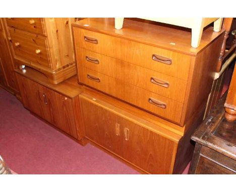 A 1960s G-Plan teak low chest of three long drawers, w.81cm; together with a pair of G-Plan teak low double door side cupboar