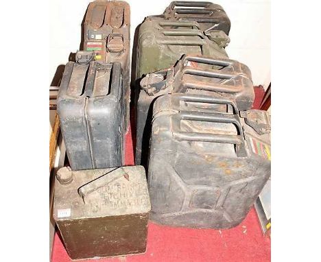 An War Department army issue metal jerry can, stamped WD and dated 1955; together with six other metal jerry cans (7)