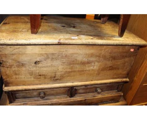 A rustic pine hinge top mule chest, having twin short lower drawers, width 89cmCondition report: Nibbles to lid, mostly to ed
