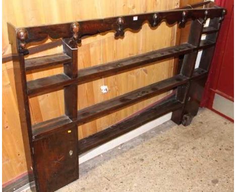 A circa 1800 provincial oak Delft rack, having twin star inlaid cupboard doors, w.180cmCondition report: Various light marks 