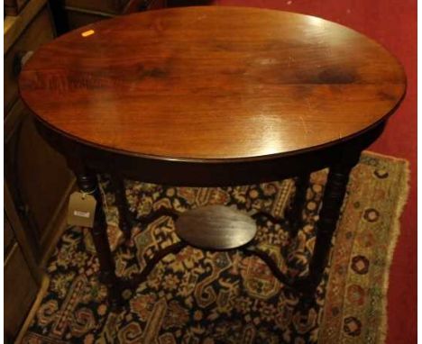 An Edwardian mahogany oval occasional table, raised on ring turned supports, width 75cm