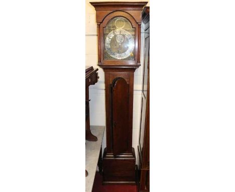 A circa 1800 provincial oak longcase clock, having an arched brass and silvered dial (worn), with subsidiary seconds dial, da